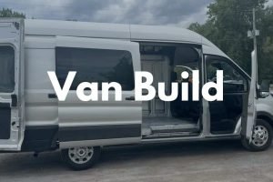 Custom van with open sliding door, ideal for outdoor adventures and travel, showcasing a versatile vehicle for exploring nature and scenic routes.